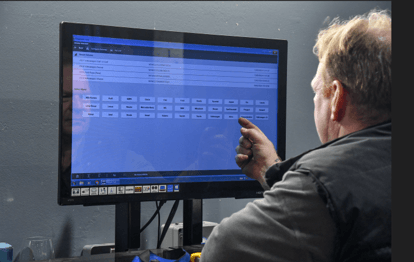 A Mechanic performing a diagnostic test on a vehicle